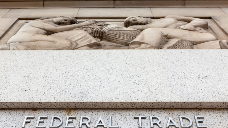 Federal Trade Commission building facade with a sculpture depicting workers and grain.